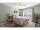 Charming bedroom with a ceiling fan, window, neutral tones, decorative fish art, and comfortable furnishings at 9679 Stillwater Ct., Myrtle Beach, SC 29572