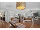 Dining area with seating for four, stylish lighting, and views into the living room and connecting kitchen at 9679 Stillwater Ct., Myrtle Beach, SC 29572
