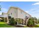 Back of house, featuring stairs to the front door and well-maintained lawn at 9679 Stillwater Ct., Myrtle Beach, SC 29572