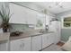 Bright kitchen with white cabinets and appliances at 9679 Stillwater Ct., Myrtle Beach, SC 29572