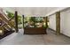 Outdoor patio with wicker seating and serene green backyard at 9679 Stillwater Ct., Myrtle Beach, SC 29572