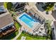 Aerial view of community pool with lounge chairs and well-maintained grounds at 9679 Stillwater Ct., Myrtle Beach, SC 29572