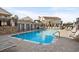 Community pool with lounge seating and views of surrounding properties at 9679 Stillwater Ct., Myrtle Beach, SC 29572