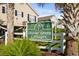 Ocean Green Cottages sign with lush tropical landscaping at 9679 Stillwater Ct., Myrtle Beach, SC 29572