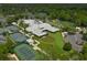 Aerial view of community amenities, including tennis courts, clubhouse, green spaces, and meticulously landscaped grounds at 9820 Queensway Blvd. # 804, Myrtle Beach, SC 29572