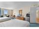 Well-lit bedroom with two beds, a table with chairs, and balcony access with city views at 9820 Queensway Blvd. # 804, Myrtle Beach, SC 29572