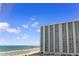Scenic ocean view of condo building with beach access and blue skies at 9820 Queensway Blvd. # 804, Myrtle Beach, SC 29572