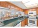 Well-equipped kitchen featuring a breakfast bar, stainless steel sink and modern appliances at 9820 Queensway Blvd. # 804, Myrtle Beach, SC 29572