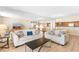 Inviting living room featuring stylish decor and an open layout into the kitchen and dining areas at 9820 Queensway Blvd. # 804, Myrtle Beach, SC 29572