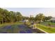Scenic view of well-maintained pickleball courts surrounded by lush greenery, providing an active lifestyle at 9820 Queensway Blvd. # 804, Myrtle Beach, SC 29572
