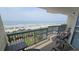 Balcony with chairs overlooking the beach and ocean at 102 N Ocean Blvd. # 405, North Myrtle Beach, SC 29582