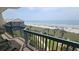 Balcony with chairs overlooking the beach and ocean at 102 N Ocean Blvd. # 405, North Myrtle Beach, SC 29582