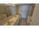 Bright bathroom featuring a double sink vanity and a glass-enclosed shower at 102 N Ocean Blvd. # 405, North Myrtle Beach, SC 29582