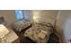 Comfortable bedroom features two beds, soft lighting, and neutral decor for a relaxing stay at 102 N Ocean Blvd. # 405, North Myrtle Beach, SC 29582