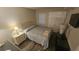 Neutral bedroom offers a queen bed, nightstand, and closet for a simplistic and clean design at 102 N Ocean Blvd. # 405, North Myrtle Beach, SC 29582