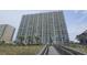 View of tall building with multiple balconies showing coastal living at its finest near sandy beaches at 102 N Ocean Blvd. # 405, North Myrtle Beach, SC 29582