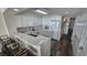 Bright kitchen with white cabinetry, breakfast bar and stainless steel appliances at 102 N Ocean Blvd. # 405, North Myrtle Beach, SC 29582