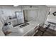 Bright kitchen with white cabinets, marble countertops, and stainless steel appliances at 102 N Ocean Blvd. # 405, North Myrtle Beach, SC 29582