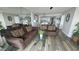 Cozy living room with comfortable seating and mirrored wall at 102 N Ocean Blvd. # 405, North Myrtle Beach, SC 29582
