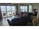 Bright living room with ocean views, comfortable seating, and access to the balcony at 102 N Ocean Blvd. # 405, North Myrtle Beach, SC 29582