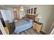 Comfortable bedroom with a four-poster bed, ceiling fan and two dressers at 102 N Ocean Blvd. # 405, North Myrtle Beach, SC 29582
