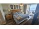 Relaxing bedroom with four-poster bed and ocean view balcony access at 102 N Ocean Blvd. # 405, North Myrtle Beach, SC 29582