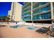 Lounge by the multiple pools and hot tubs in this attractive community surrounded by lush landscaping at 102 N Ocean Blvd. # 405, North Myrtle Beach, SC 29582