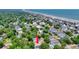 Aerial view highlighting the home's location in a neighborhood near the beach and a pond at 108 N Oak Dr., Surfside Beach, SC 29575