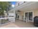 Outdoor back porch with ceiling fan and plenty of seating at 108 N Oak Dr., Surfside Beach, SC 29575