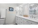Bright bathroom features double sinks, marble countertops, and updated fixtures at 108 N Oak Dr., Surfside Beach, SC 29575