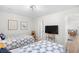 Cozy bedroom with two twin beds, television, and view to adjacent living space at 108 N Oak Dr., Surfside Beach, SC 29575