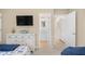 Well lit bedroom has dresser and a doorway leading to the bathroom at 108 N Oak Dr., Surfside Beach, SC 29575