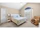 Bright bedroom features vaulted ceiling, ceiling fan, queen bed, and a large window at 108 N Oak Dr., Surfside Beach, SC 29575