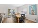 Charming dining area with a rustic table, stylish chairs, and natural light at 108 N Oak Dr., Surfside Beach, SC 29575