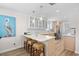 Bright, modern kitchen with bar stool seating, hardwood floors and stainless steel appliances at 108 N Oak Dr., Surfside Beach, SC 29575