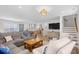 Open-concept living room flowing into kitchen area, featuring modern decor and comfortable seating at 108 N Oak Dr., Surfside Beach, SC 29575
