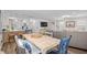 Open floorplan with dining area and living room featuring hardwood floors at 108 N Oak Dr., Surfside Beach, SC 29575