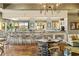 Upscale bar and lounge area with hardwood floors, a long countertop, pendant lighting and an open view of the city at 1105 S Ocean Blvd. # 928, Myrtle Beach, SC 29577
