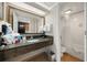 Functional bathroom with a large mirror, granite countertop, and shower/tub combination at 1105 S Ocean Blvd. # 928, Myrtle Beach, SC 29577