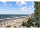 This eye-level beachside oasis boasts sandy shores, blue umbrellas, and clear ocean views at 1105 S Ocean Blvd. # 928, Myrtle Beach, SC 29577