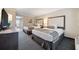 Comfortable bedroom featuring two beds, soft carpet, and a view of the ocean at 1105 S Ocean Blvd. # 928, Myrtle Beach, SC 29577