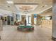 An inviting lobby with tiled floor features a water fountain, chandelier, seating, and a reception desk at 1105 S Ocean Blvd. # 928, Myrtle Beach, SC 29577