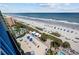 Enjoy a resort-style view of a spacious patio, a sparkling pool, and clear ocean waters at 1105 S Ocean Blvd. # 928, Myrtle Beach, SC 29577