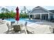 Community pool with covered area, picnic tables, and seating surrounded by lush landscaping and inviting atmosphere at 1141 Prescott Circle, Myrtle Beach, SC 29577