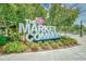 Welcoming sign for The Market Common surrounded by landscaping and trees in a vibrant community at 1141 Prescott Circle, Myrtle Beach, SC 29577