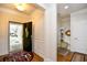 Bright foyer featuring a stylish front door, hardwood floors, and decorative trim at 1141 Prescott Circle, Myrtle Beach, SC 29577