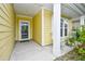 Welcoming front porch with white columns and a storm door at 1141 Prescott Circle, Myrtle Beach, SC 29577