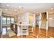 Open kitchen with granite countertops, stainless steel appliances and an adjacent staircase at 1141 Prescott Circle, Myrtle Beach, SC 29577