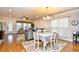 Open-concept dining and living area with hardwood floors and plenty of natural light at 1141 Prescott Circle, Myrtle Beach, SC 29577