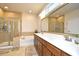 Luxurious main bathroom with double vanity, soaking tub, and glass-enclosed shower at 1141 Prescott Circle, Myrtle Beach, SC 29577